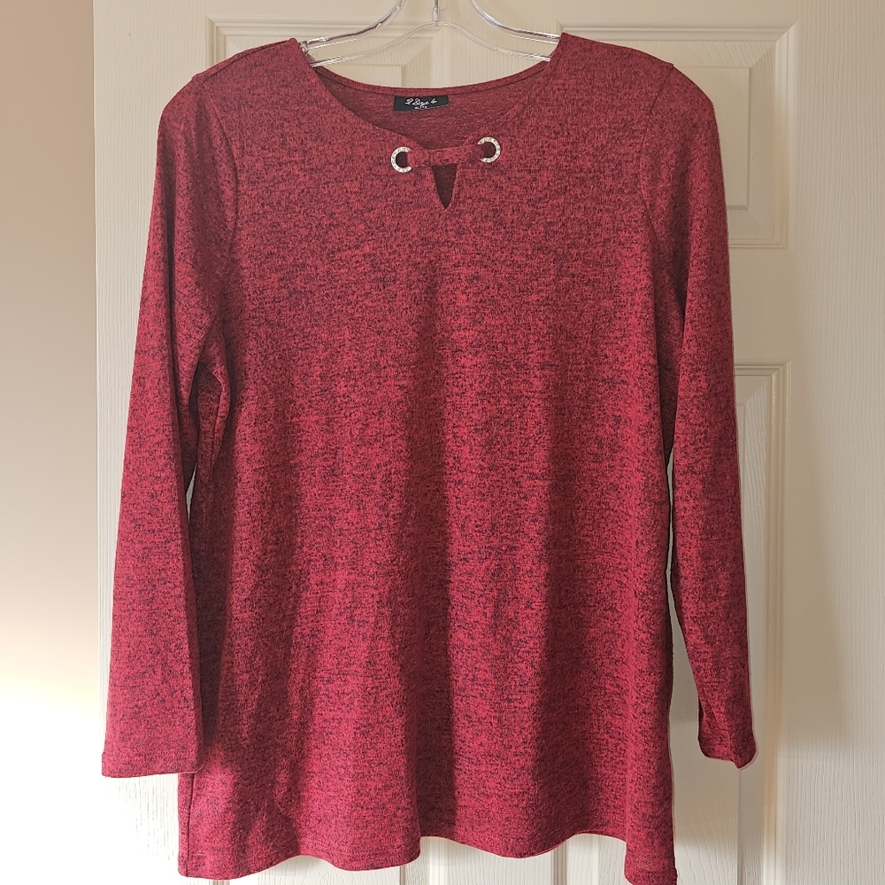 Red shirt with 3/4 length sleeves.